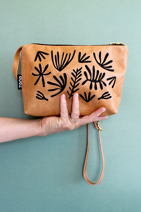 Leather bag with leaf motif by Zana Products