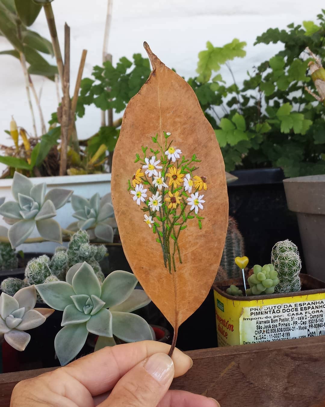 Embroidery on leaves by Solange Nunes