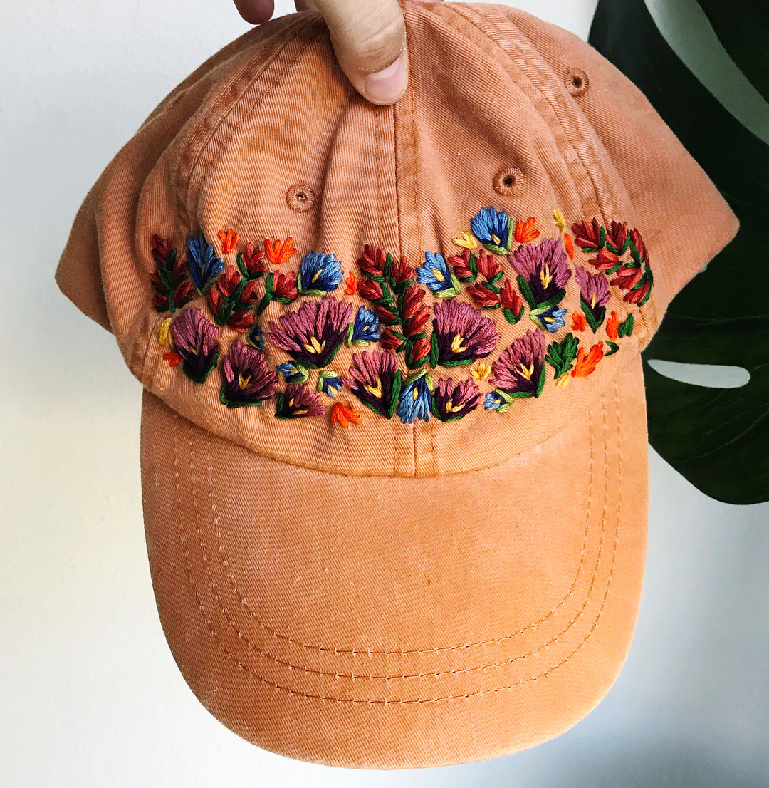 Hand embroidered hat with flowers by Lexi Mire