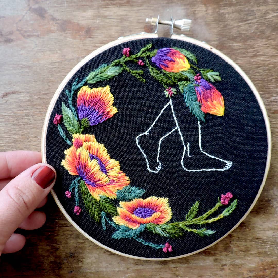 Embroidery on black fabric by Claudia González 