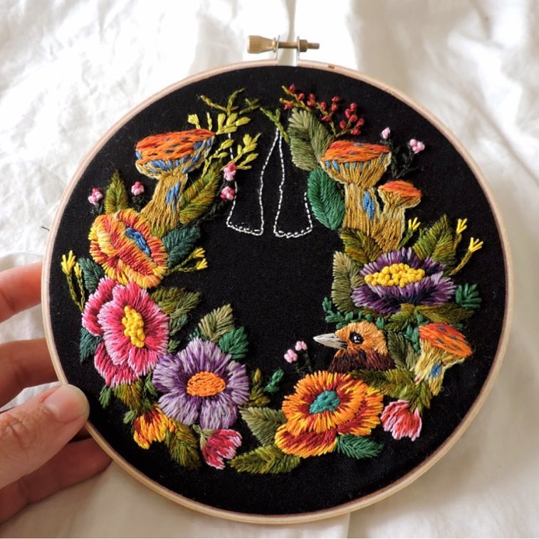 Embroidery on black fabric by Claudia González 