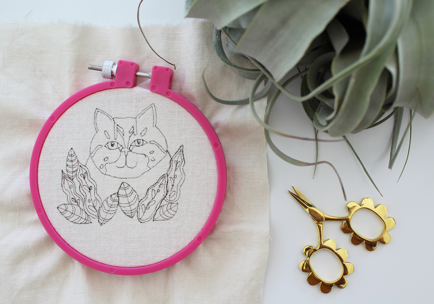 Plant and cat embroidery by Sara Barnes