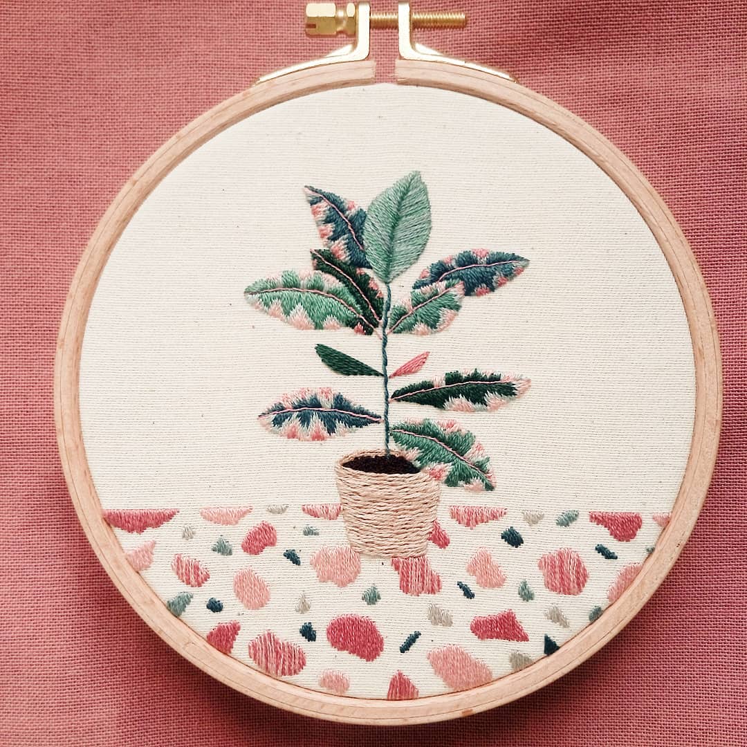 Hand embroidery of a plant