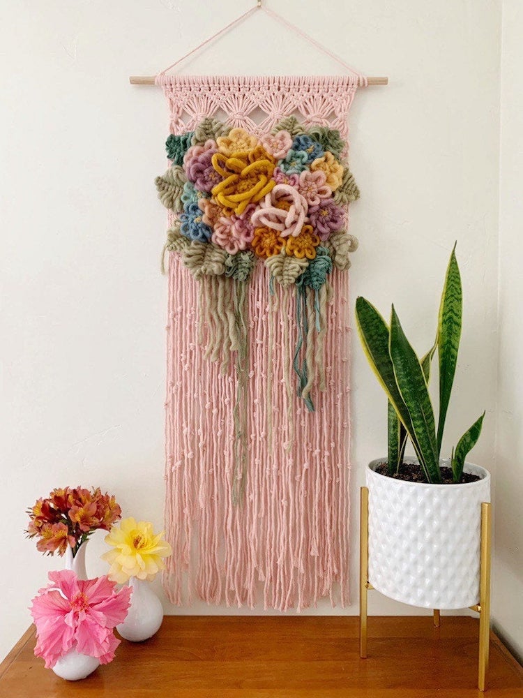 Modern macrame wall hanging with yarn flowers