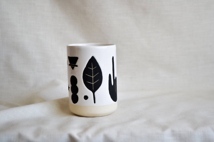 Illustrated ceramic cup