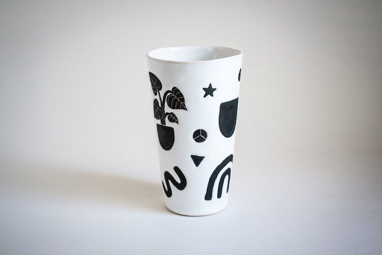 Illustrated ceramic cup