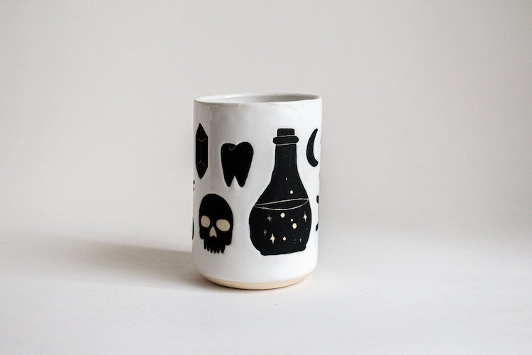 Illustrated ceramic cup