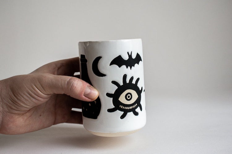 Illustrated ceramic cup