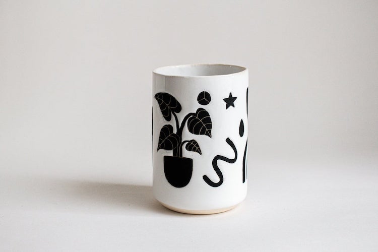 Illustrated ceramic cup