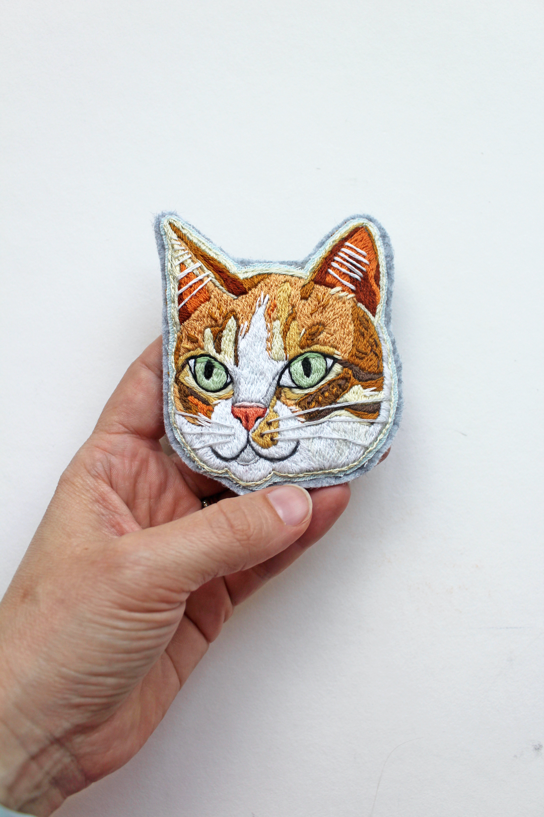 Custom embroidered patch of a cat