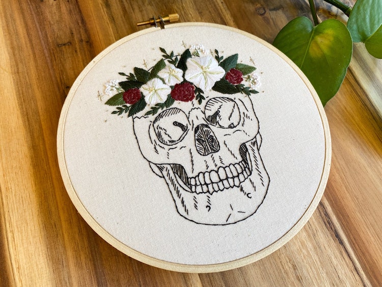 Embroidery pattern of a skull wearing a floral crown