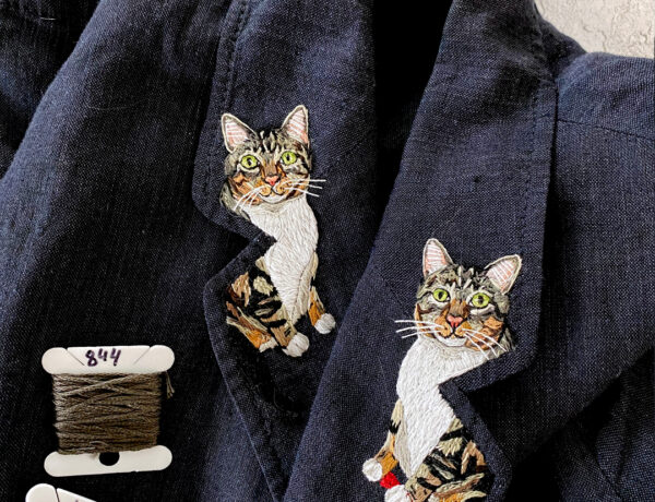 Custom cat embroideries on a collar lapel