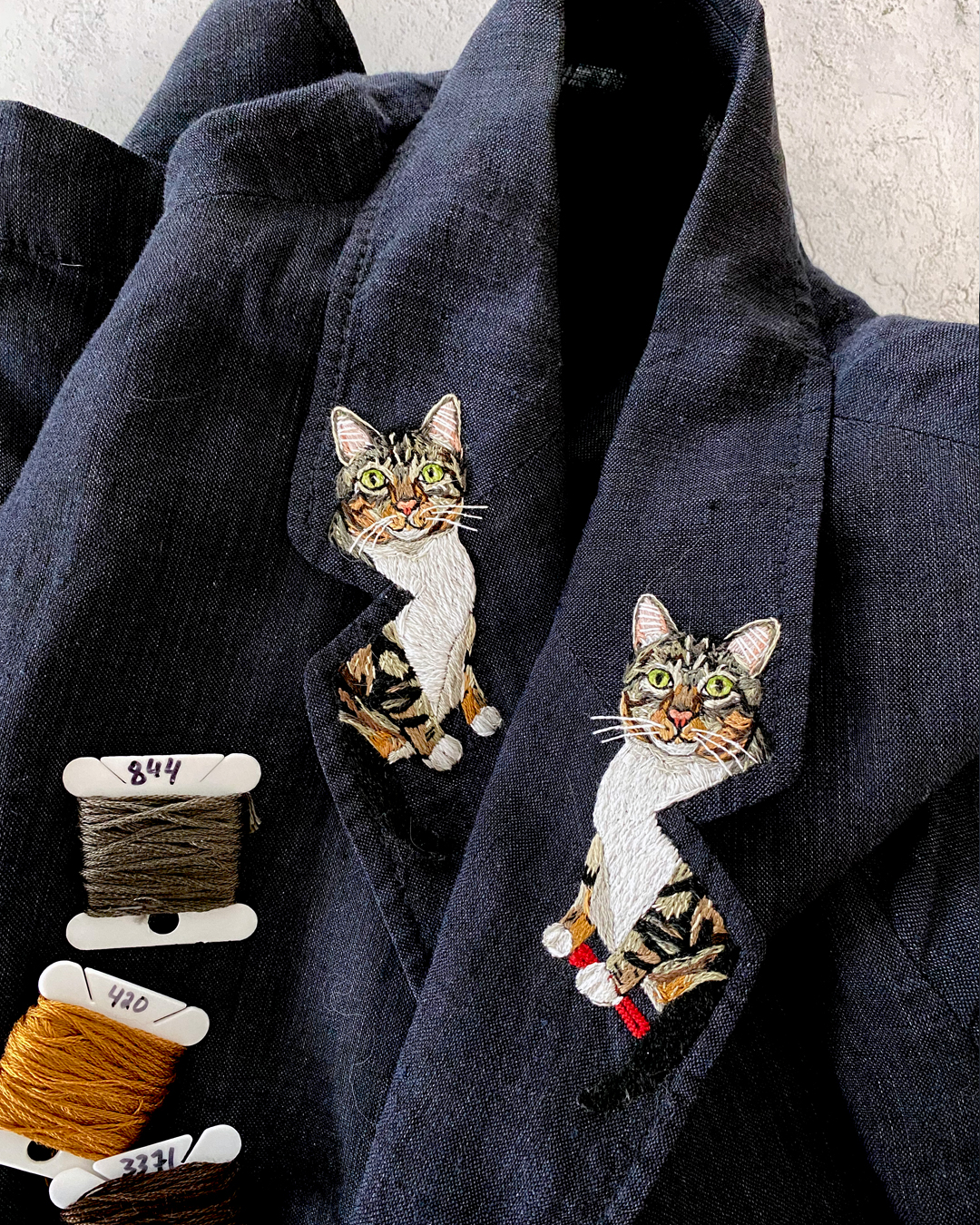 Custom cat embroideries on a collar lapel