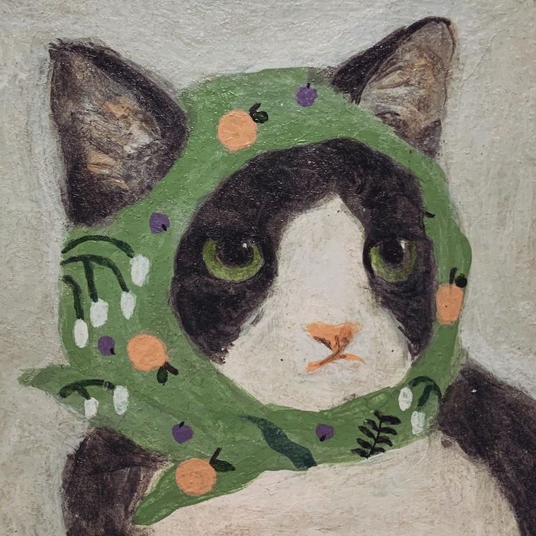 Illustration of a cat wearing a head scarf