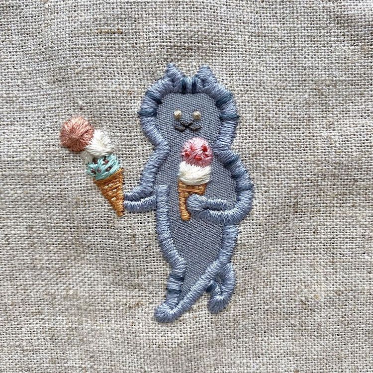 Embroidery of a Cat Carrying Ice Cream