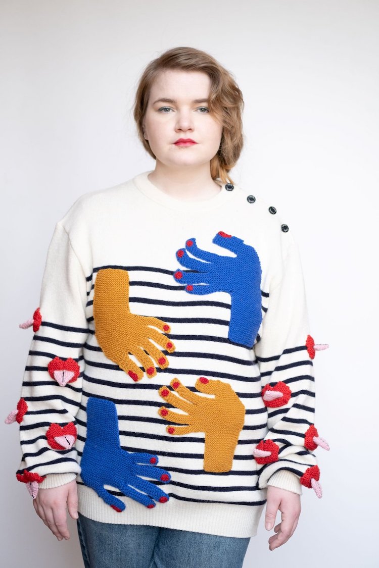 Knitted sweater with eyes and mouth on it by Ýrúrarí
