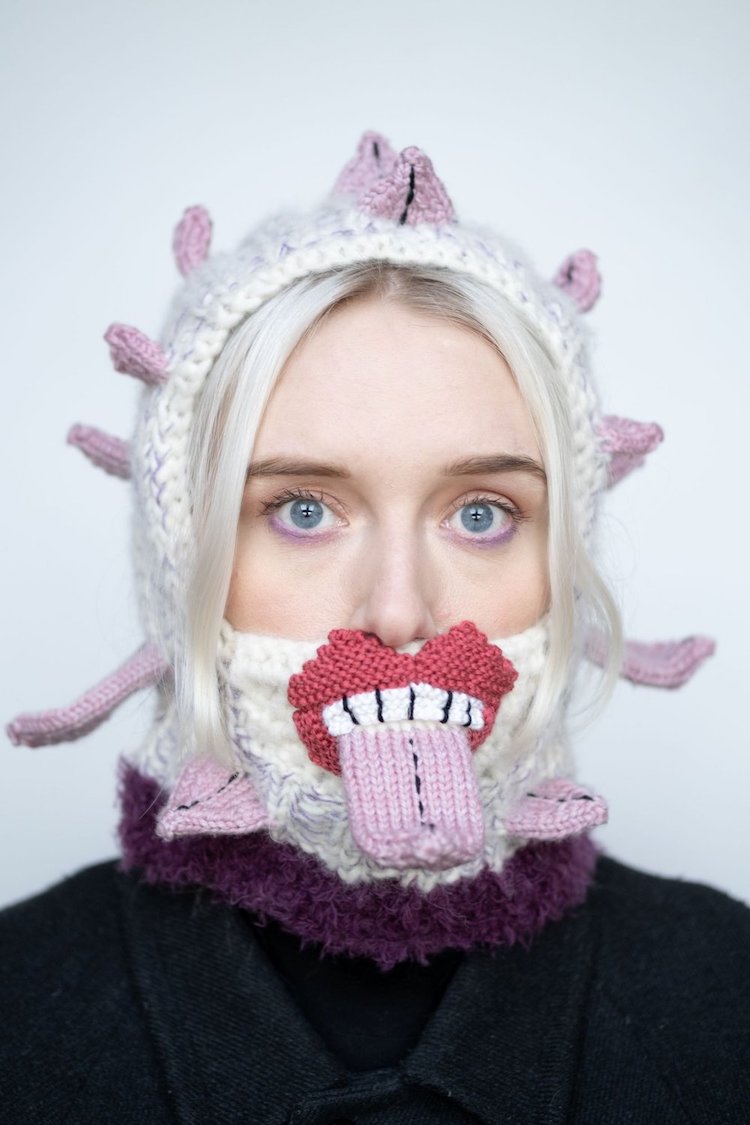 Knitted sweater with eyes and mouth on it by Ýrúrarí