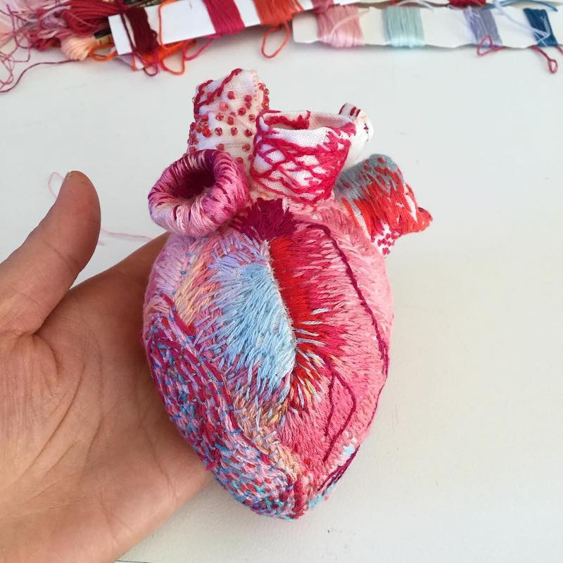 Heart sculpture featuring beading and embroidery by Ema Shin