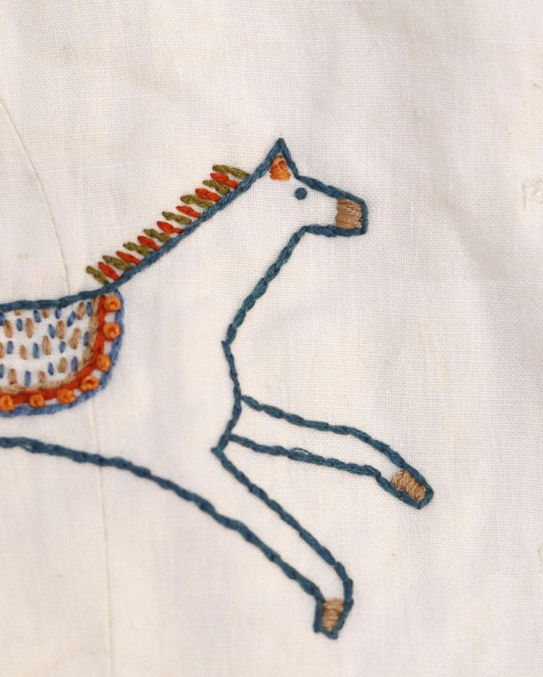 Embroidery on clothing by Madeleine Kemsley