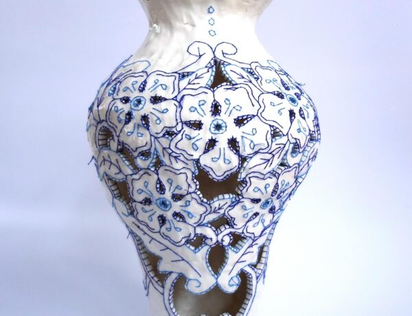 Embroidery on ceramic vase by Caroline Harrius